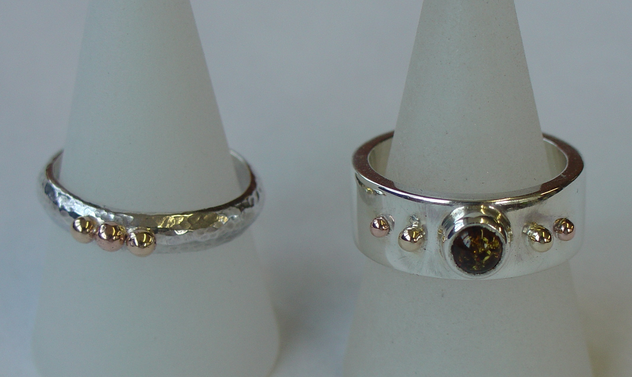 Silver, gold and amber rings