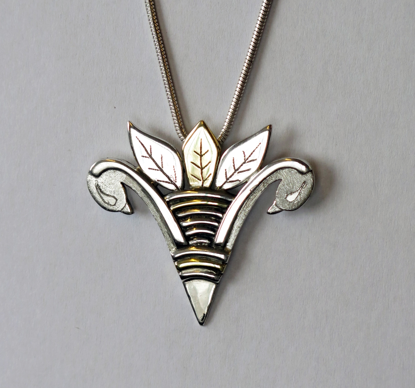 Silver birds with leaves