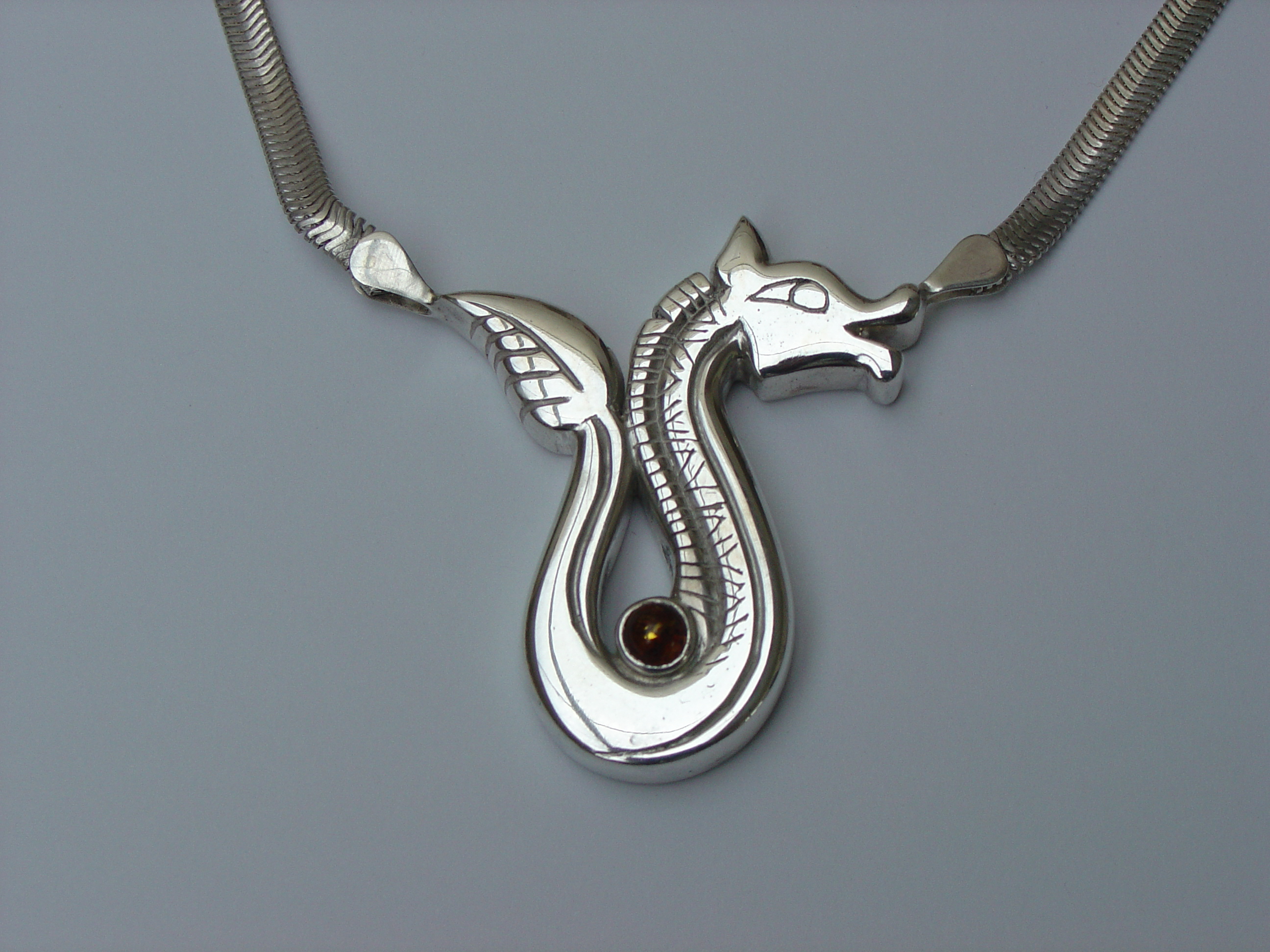 Silver animal with amber