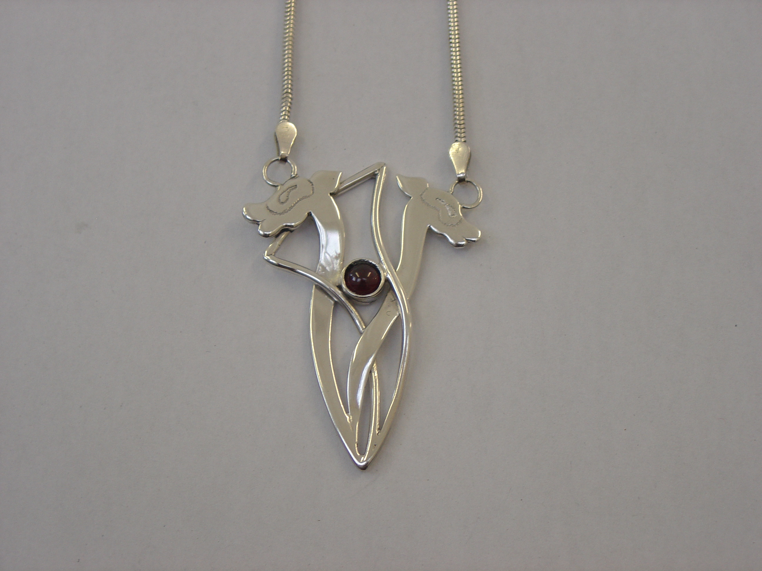 Silver animals with garnet