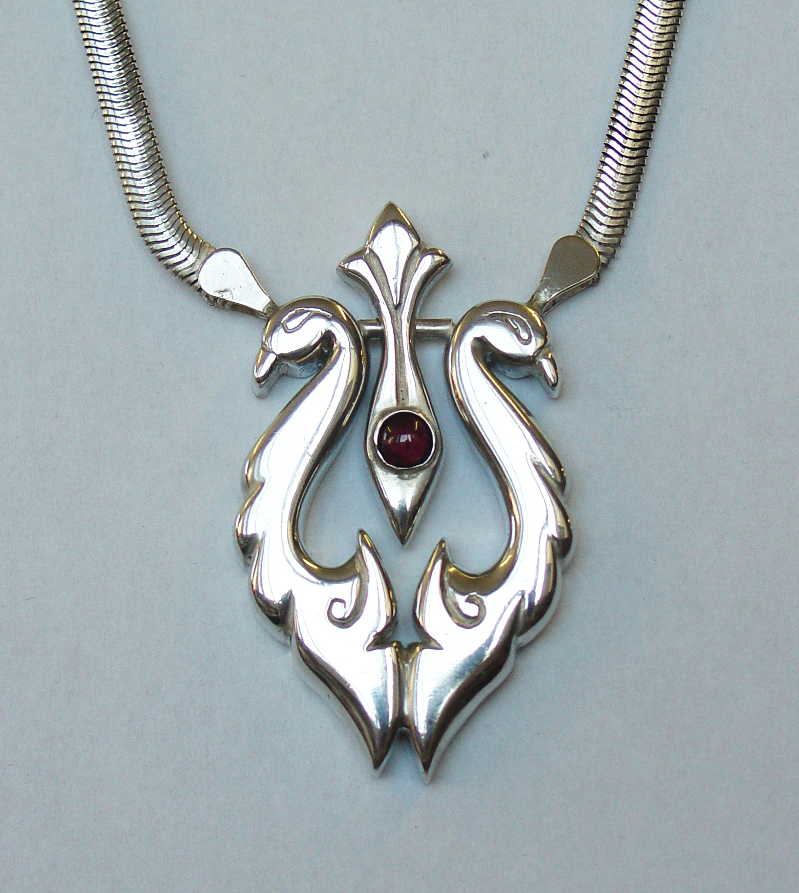 Silver birds with garnet