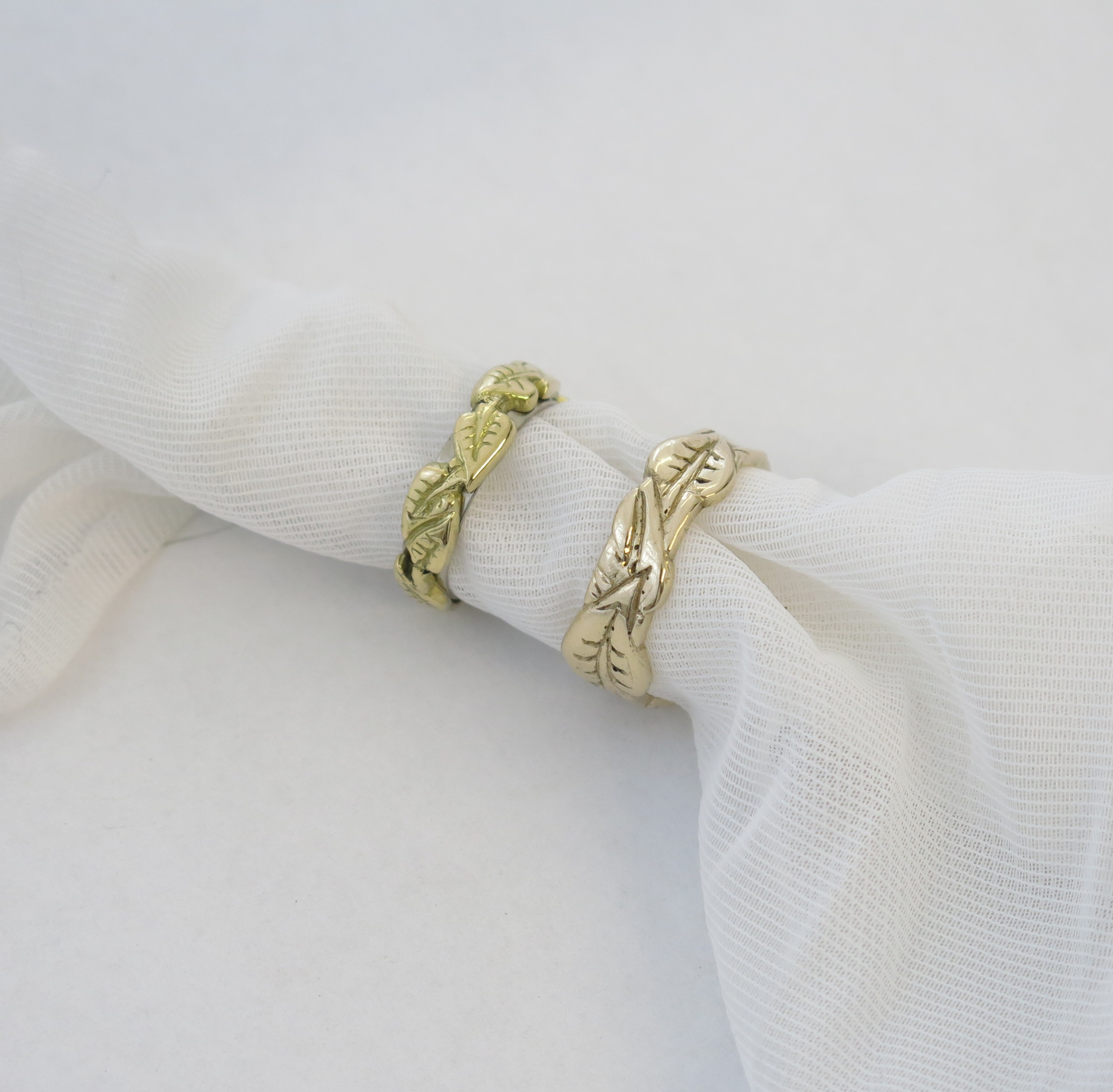 Gold wedding rings with leaf design