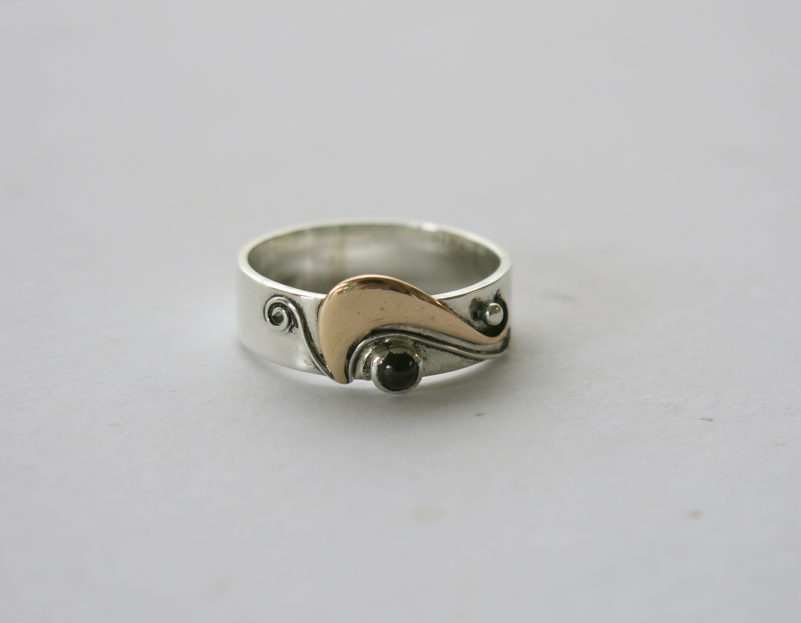 Silver,brass and garnet ring