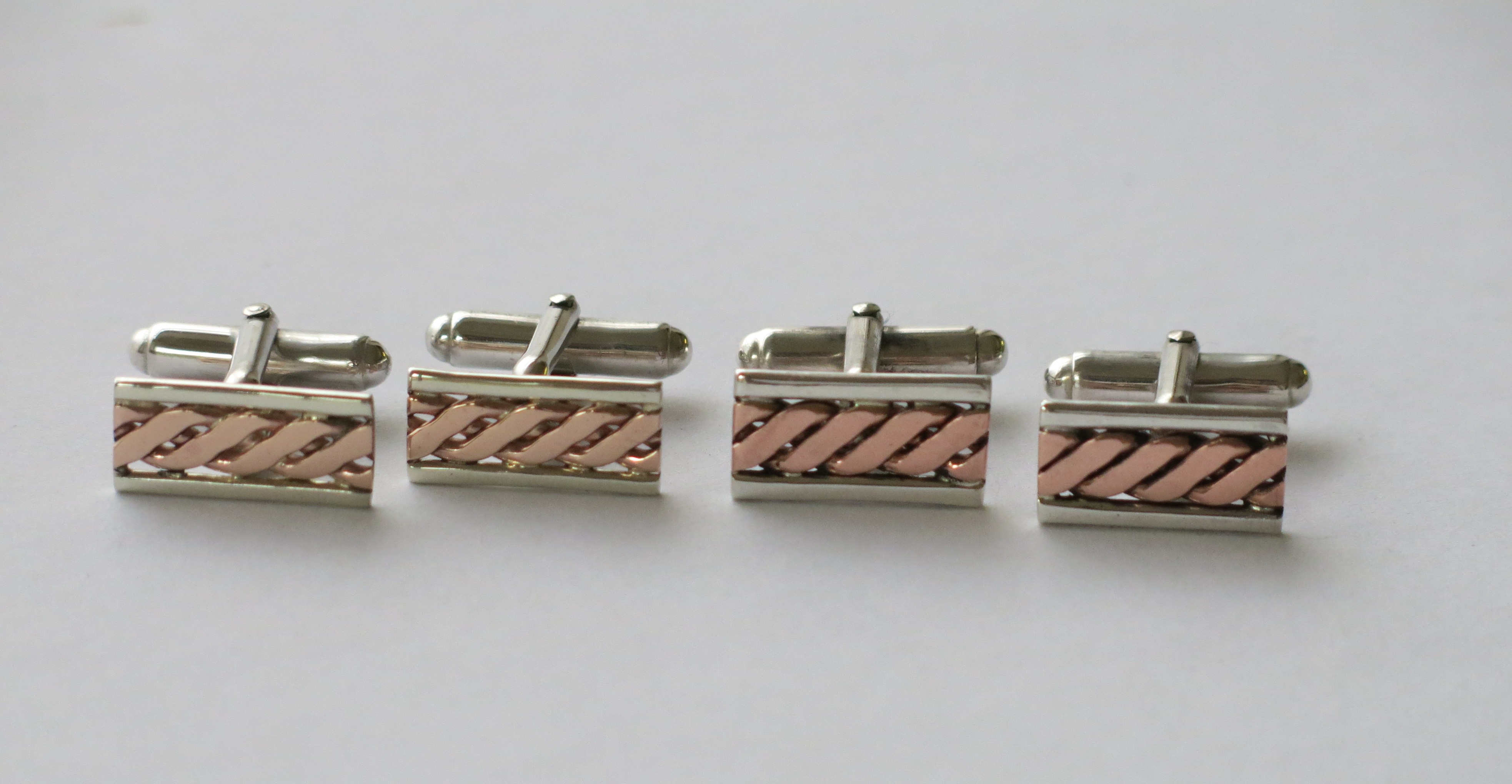 Gold. silver and copper twist cufflinks