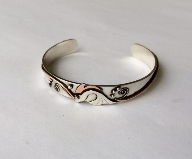 Silver and copper fish bangle