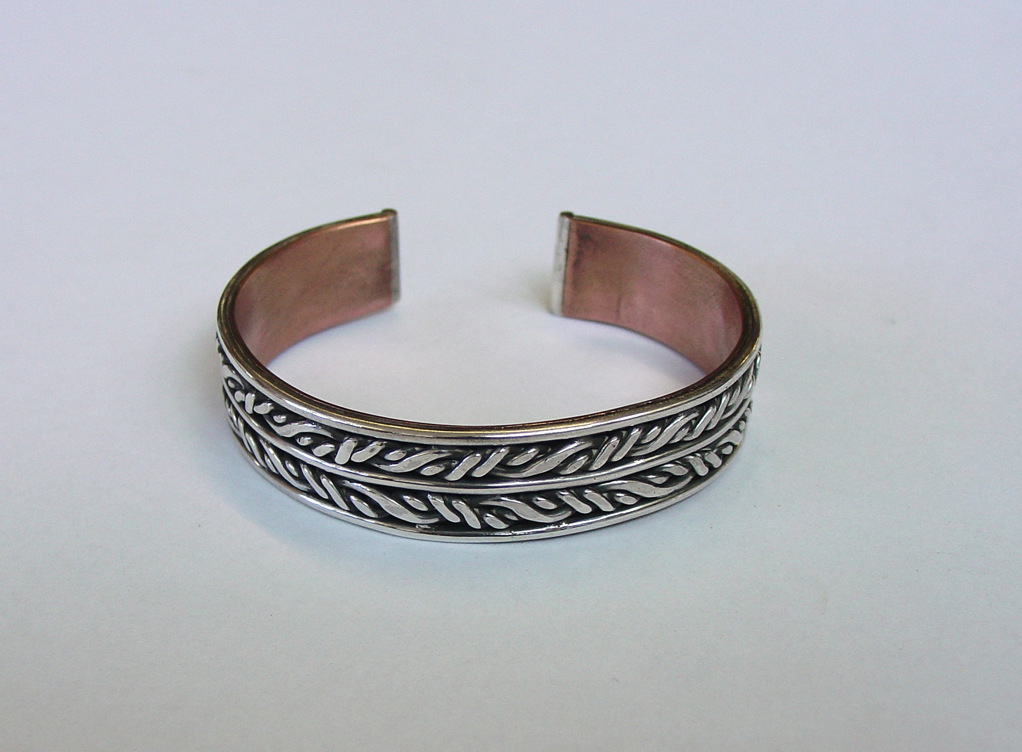 Silver twist bangle with copper backing 