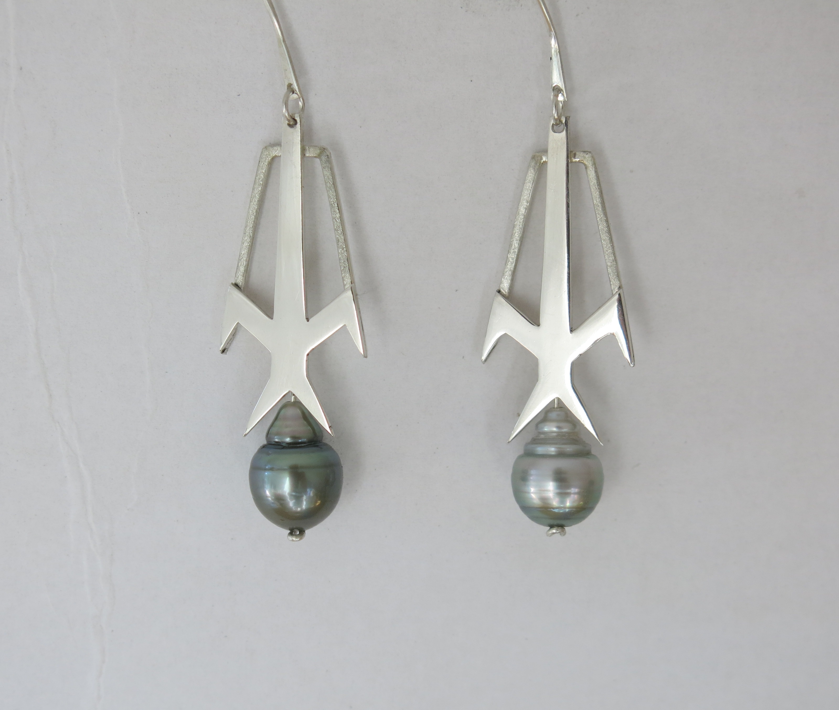 Silver frigate bird earrings with fresh water pearls