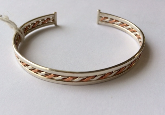 Silver and copper twist bangle