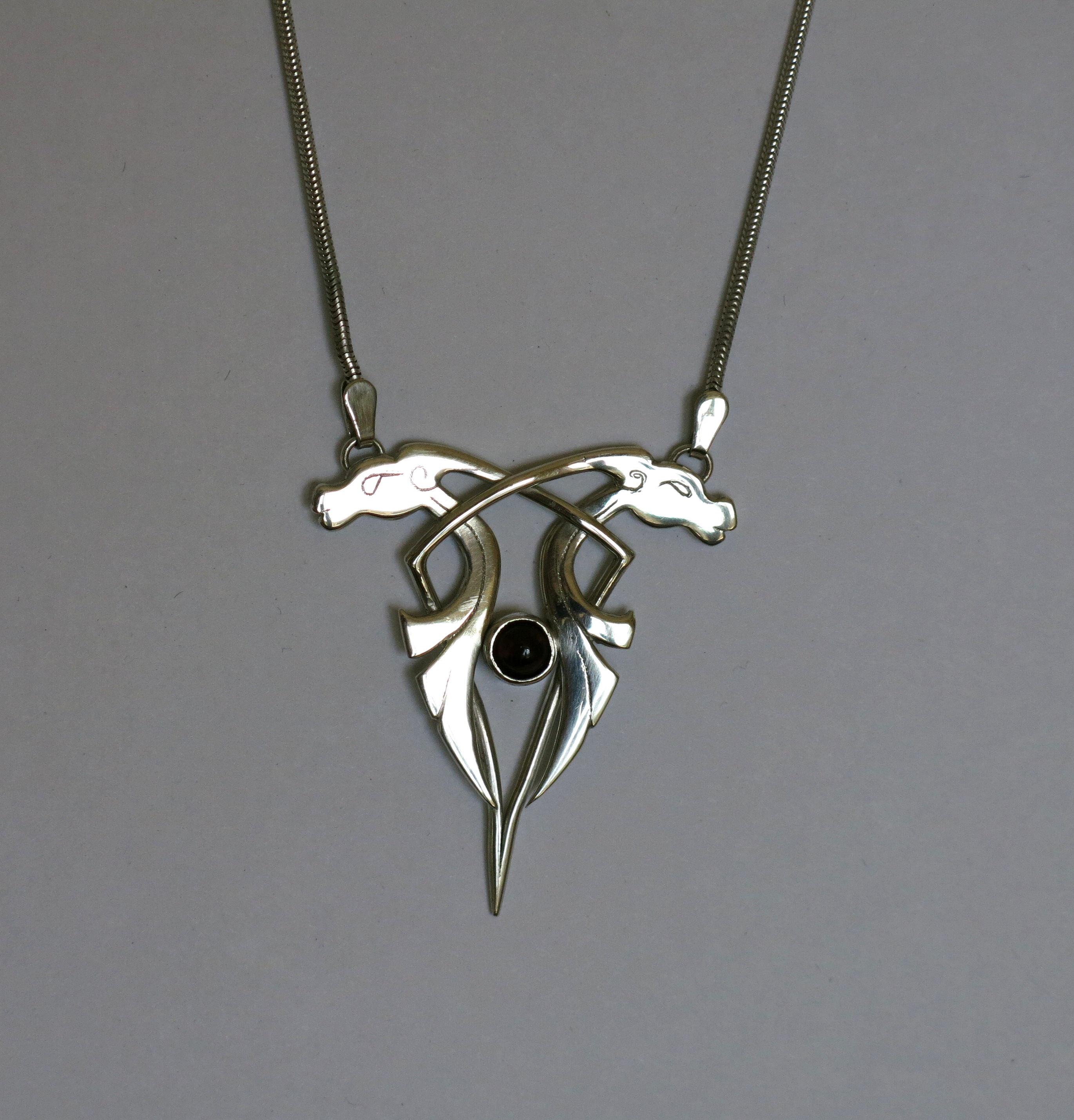 Silver animals with garnet