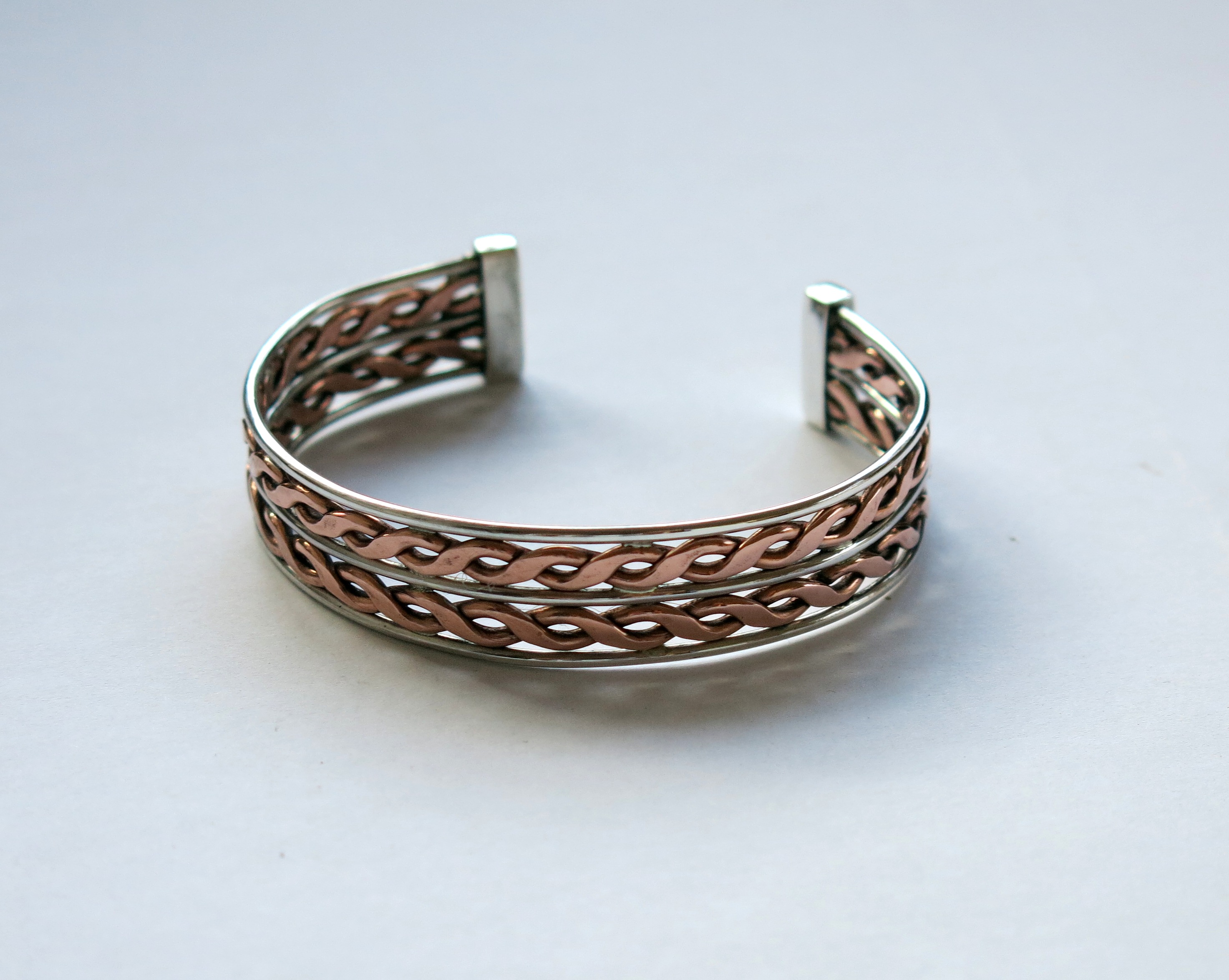 Double twist silver and copper bangle