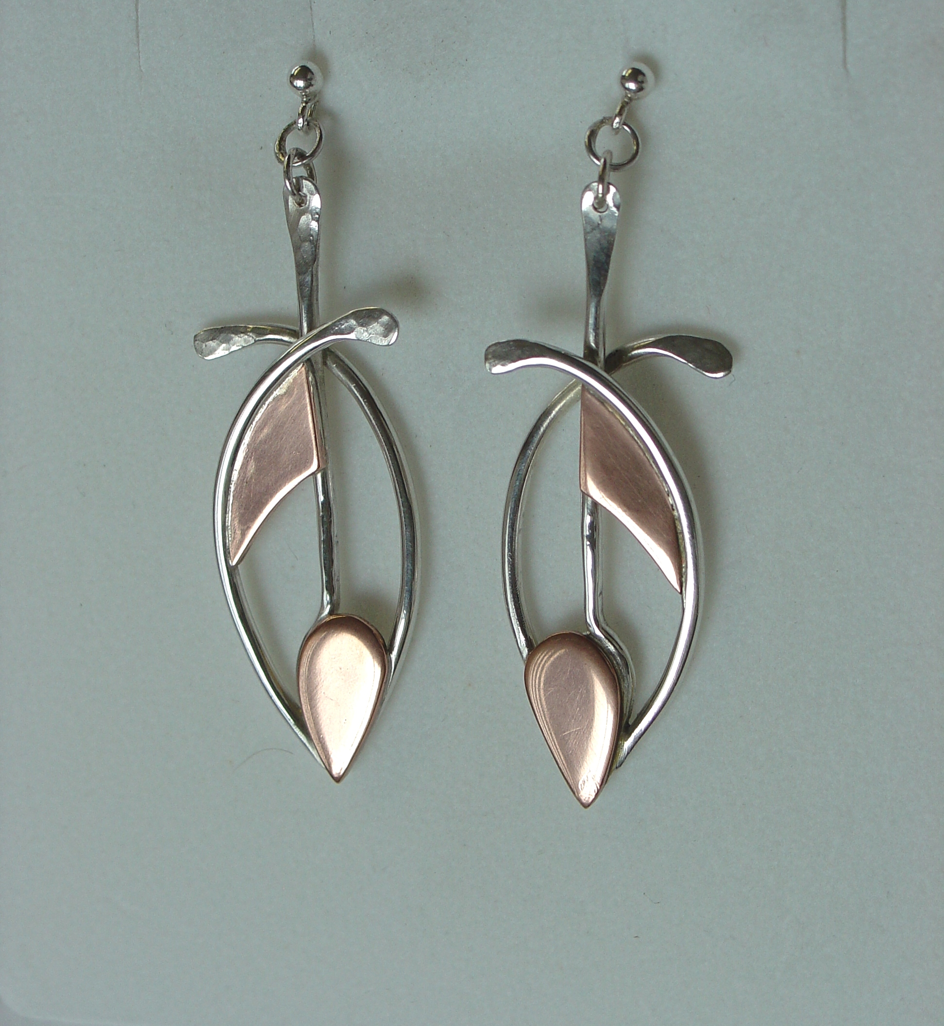 Silver and copper abstract fish earrings