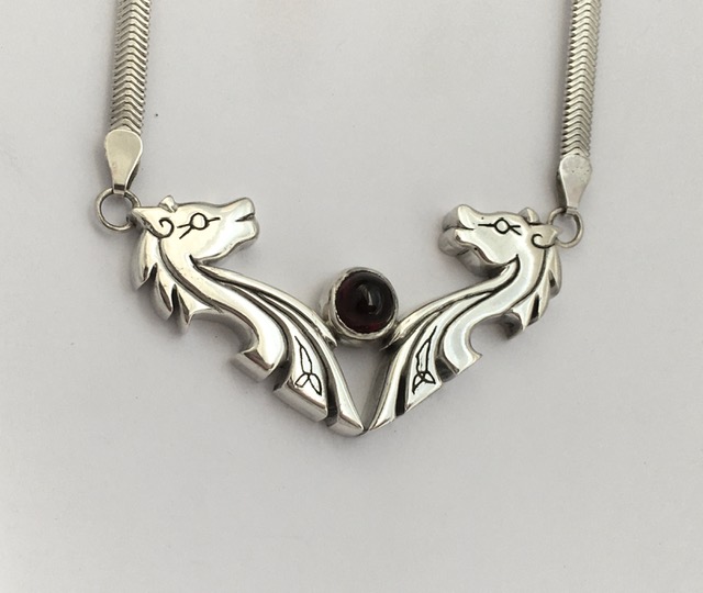 Large cast horses heads neckpiece with garnet - SOLD