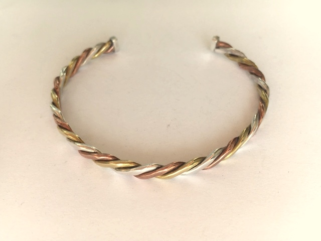 Silver, copper and brass twist bangle.